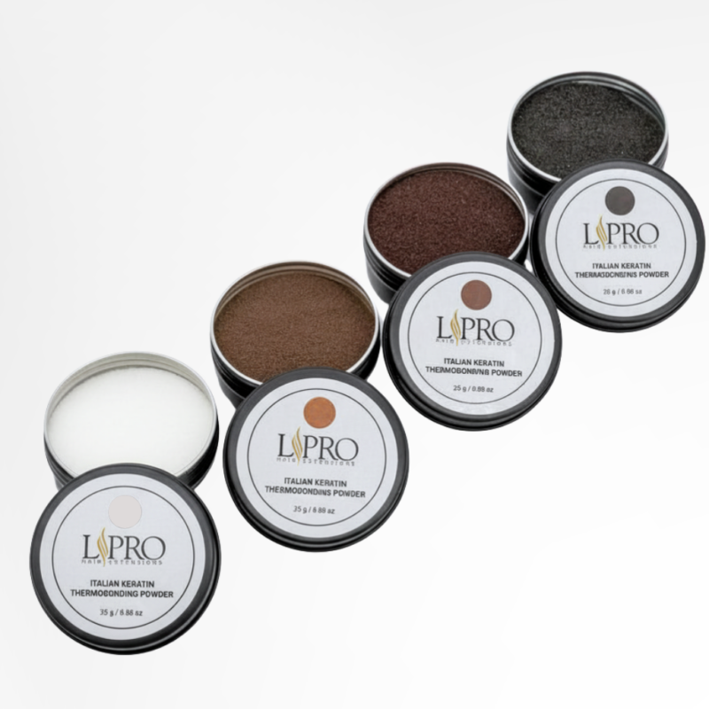 A diagonal line of 4 jars of italian keratin powder for hair extensions. Each jar has a different color powder